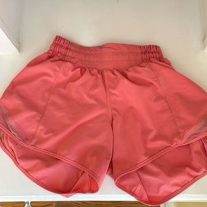 Lululemon shorts. Size 0 4 inches. Color pink. Small stain on waist band